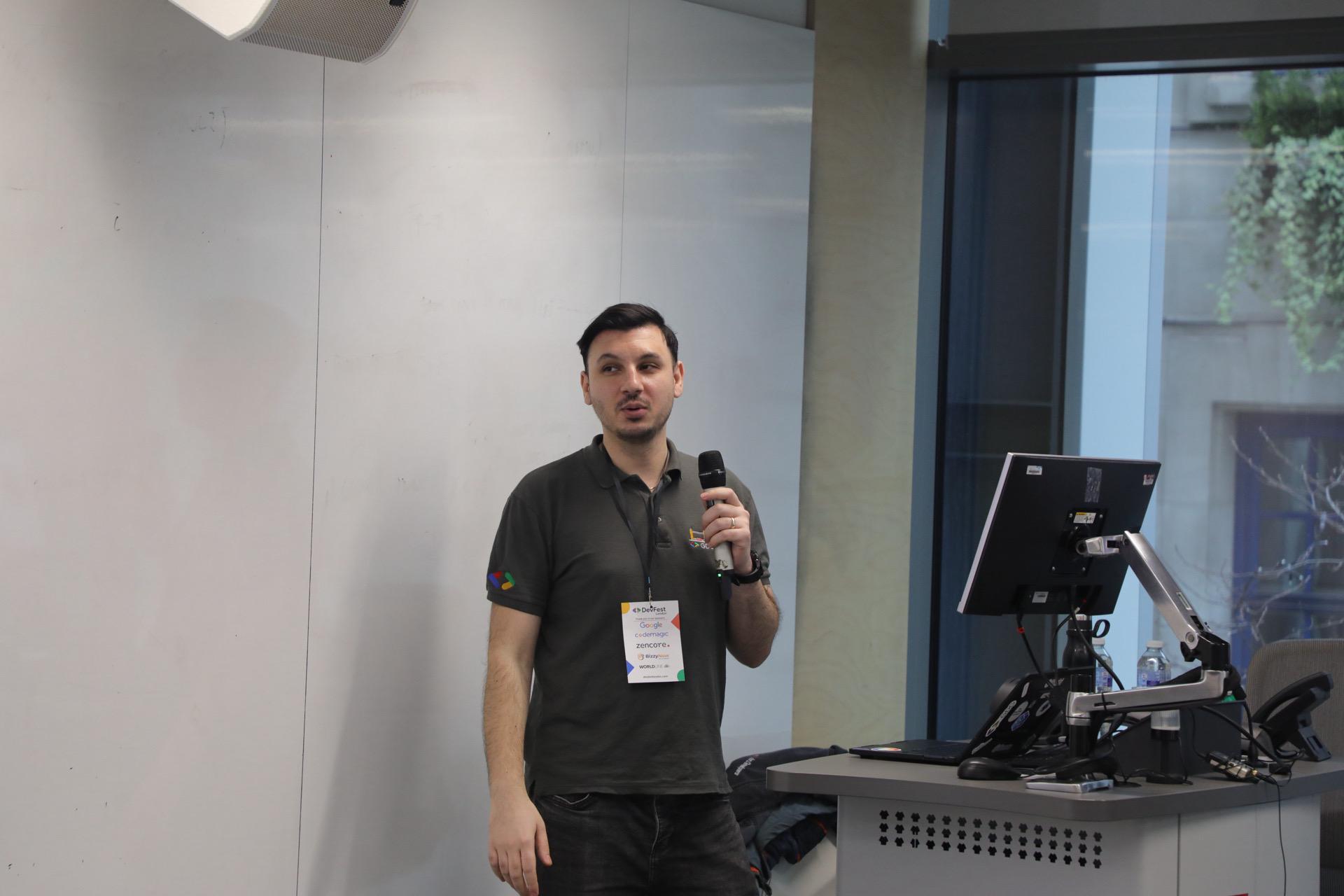 On stage at DevFest London, delivering the Go 1.25 talk